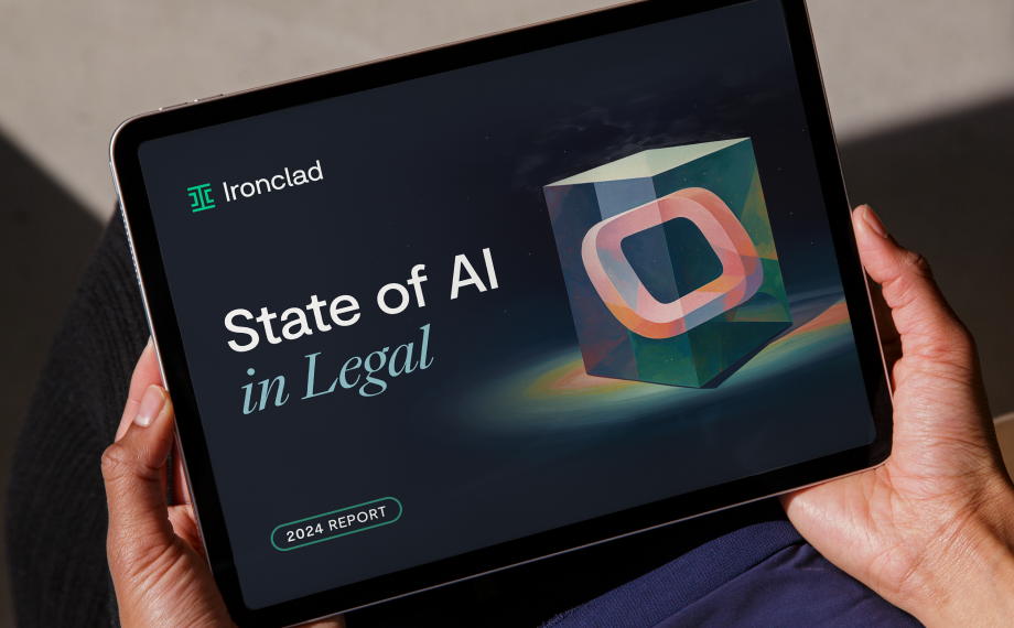 A person holds a tablet displaying a report titled State of AI in Legal by Ironclad, featuring a colorful abstract cube and a 2024 Report label on the screen.