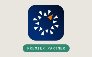 A dark blue square logo with a circular arrangement of white triangles and one orange triangle, above a green rounded rectangle with the text PREMIER PARTNER.