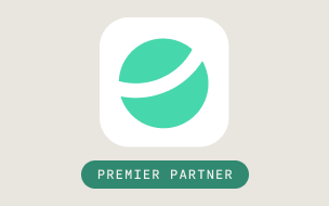A green and white abstract globe icon appears above a green rounded rectangle containing the words Premier Partner in white, all set against a light gray background.