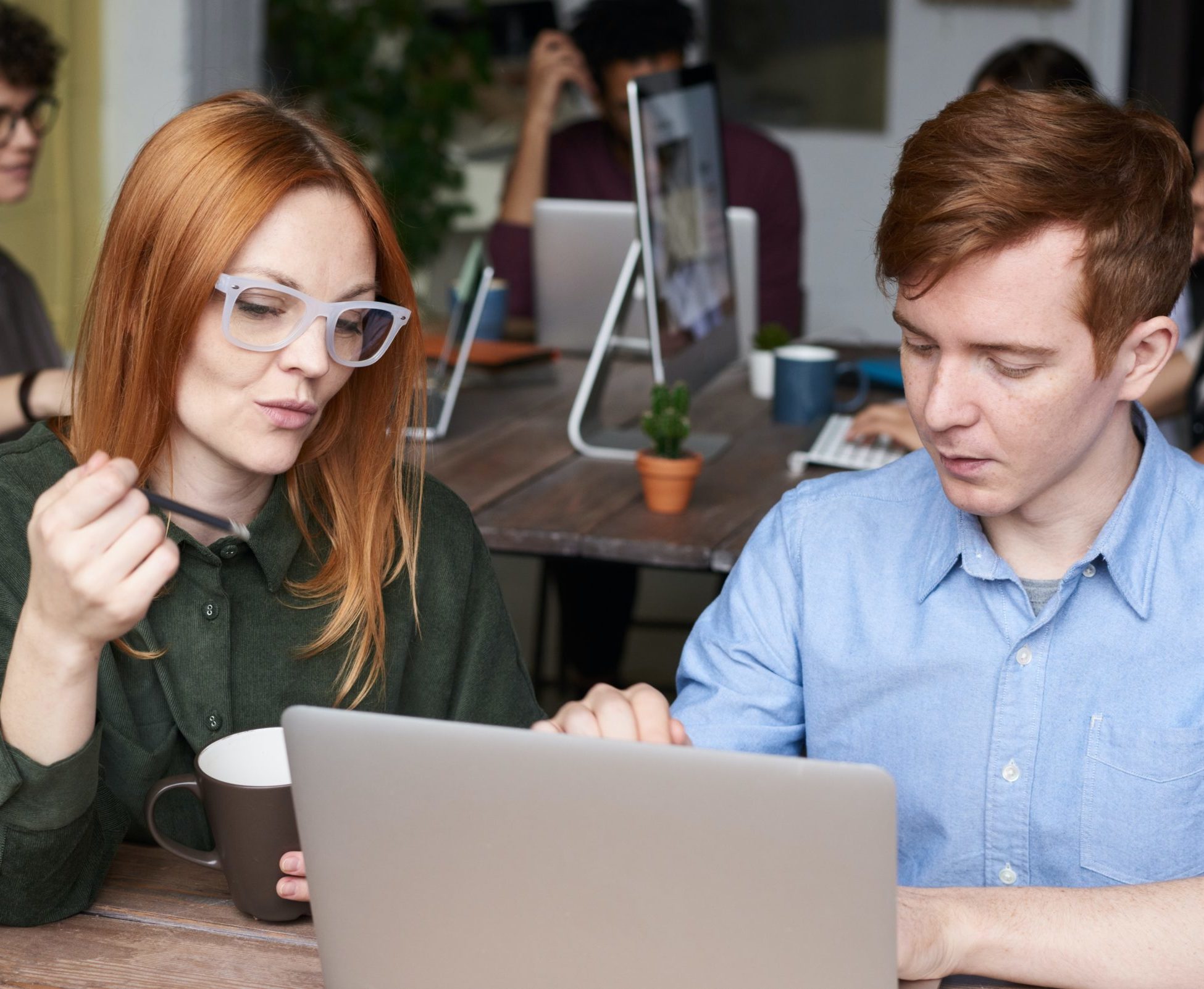 coworkers sharing tips for managing contracts