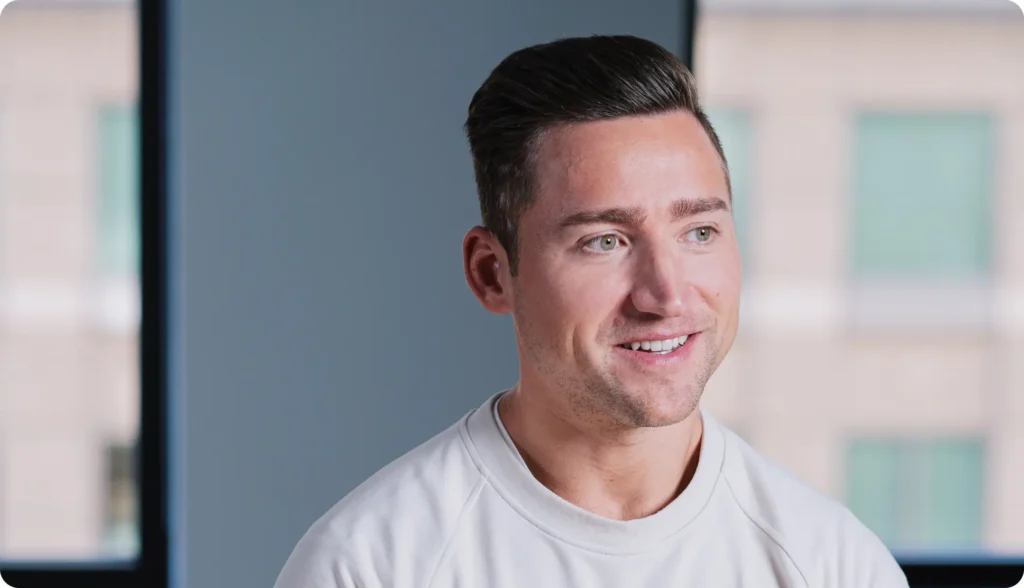 man looking off to the side soft smiling