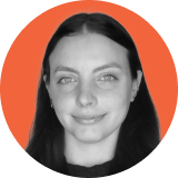 Portrait of a woman with long dark hair, light eyes, and a slight smile, set against an orange circular background. The grayscale image, accented by the bold hue, evokes the strength and clarity of ironclad CLM solutions.