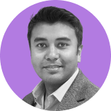 Portrait of a man with short dark hair, wearing a light-colored shirt and textured blazer, set against a circular purple background—reflecting the professionalism behind Ironclad CLM.