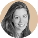 Portrait of a woman with long hair, smiling, displayed in black and white within a circular beige background, representing the approachable side of Ironclad CLM.