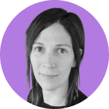 Black-and-white headshot of a woman with straight, dark hair, wearing a dark top, in front of a purple circular background—a professional look ideal for an ironclad CLM profile.