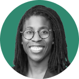 Black-and-white headshot of a person with long, locked hair, wearing round glasses and a dark jacket, smiling confidently—an Ironclad CLM expert—set against a green circular background.