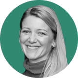 A woman with straight, light-colored hair smiles at the camera. She is wearing a turtleneck sweater, framed by a solid green circle—an image that could be perfect for your Ironclad CLM profile.