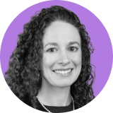 Portrait of a woman with long curly hair, smiling, wearing a dark top and necklace, against a purple circular background, representing the confidence and professionalism found in Ironclad CLM solutions.