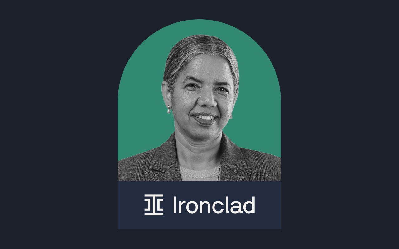 A grayscale portrait of a smiling woman with gray hair pulled back, wearing a blazer, appears against a green arch background above the Ironclad logo and name, referencing the contracting benchmark report, all set on a dark background.